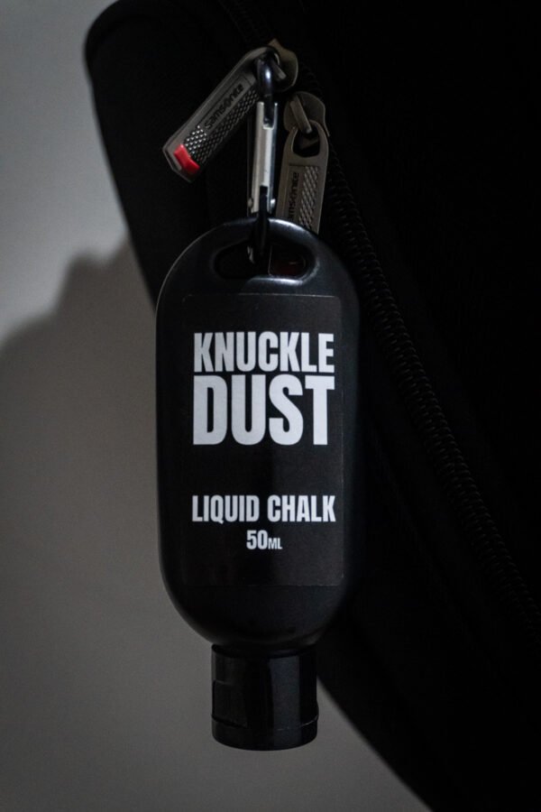 liquid chalk by Knuckledust 50ml bottle attached to a gym backpack